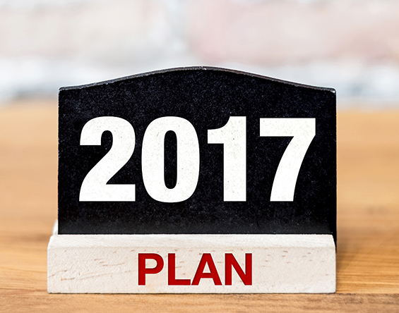 A sign on a desk that says '2017 Plan'