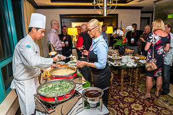 ChannelCon 2016 attendees enjoy a buffet reception