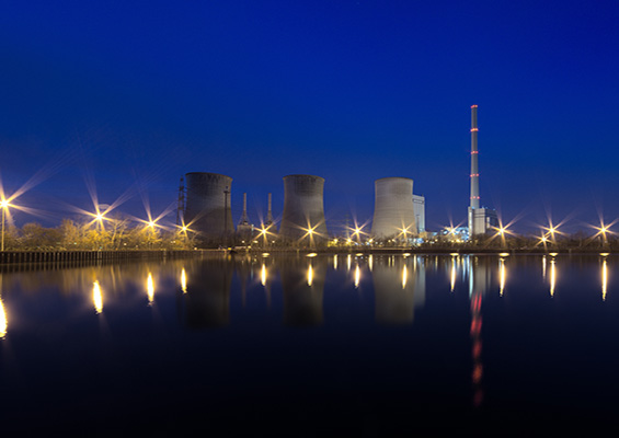 A photo of a nuclear power plant at night