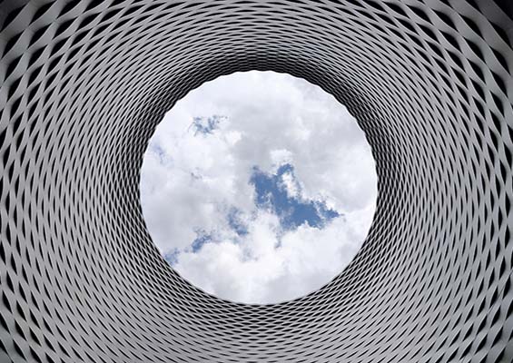 Clouds in the sky viewed through a circular opening