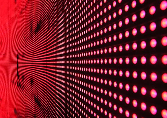 Red LED lights on a black wall