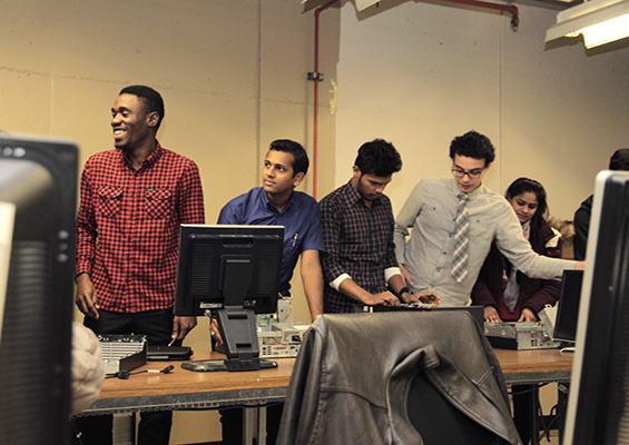 Lambton College students work on a group project in the computer lab.